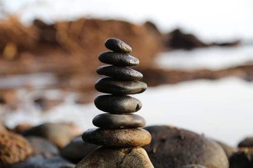 balance-work-and-home Closeup of a carefully piled stack of rocks on a beach